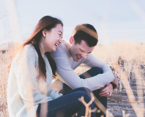 pexels-couple-1838940_1920 Senior citizens laughing on a dock