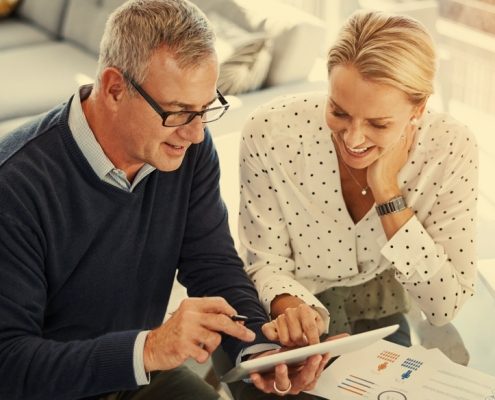 Two people reviewing financial planning