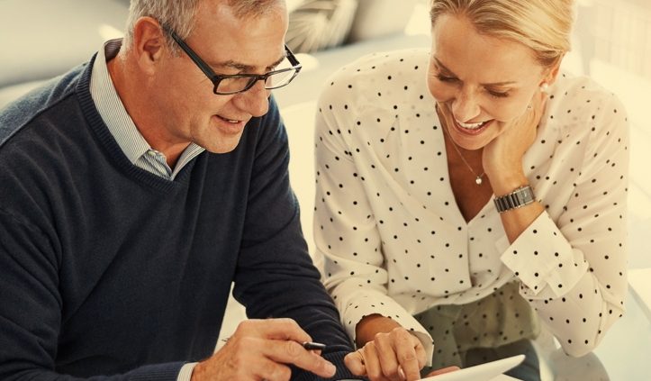 Two people reviewing financial planning