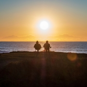 Old Couple Sits on beach