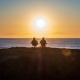 Old Couple Sits on beach
