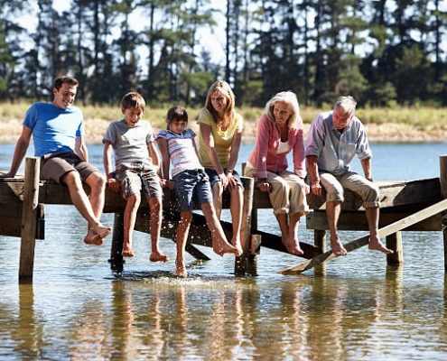 Senior citizens laughing on a dock